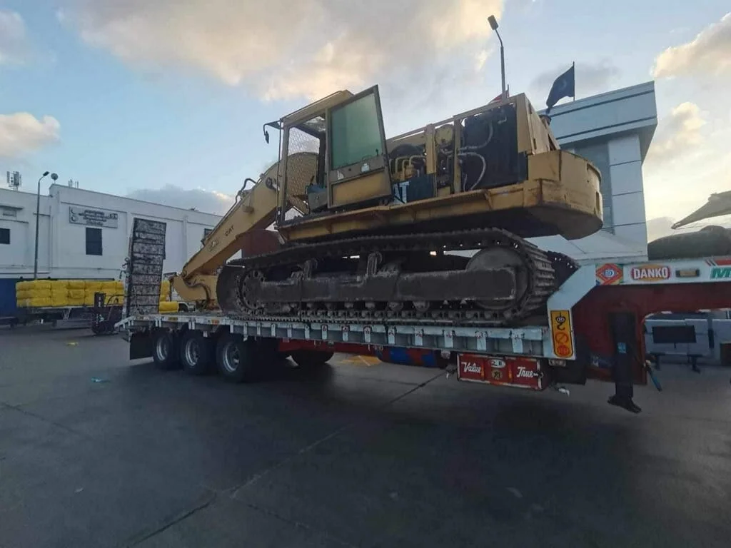 Heavy excavator on a transport trailer
