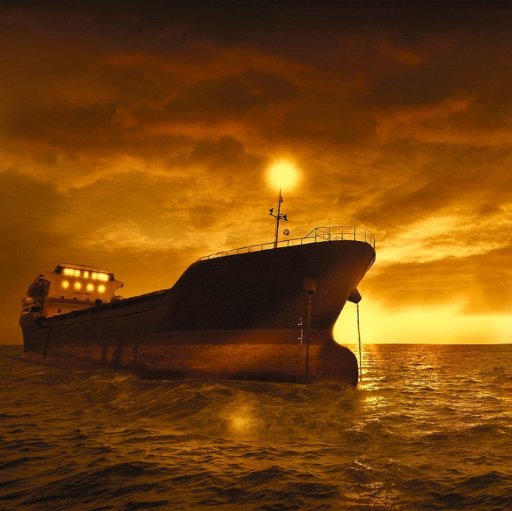 container ship ocean sunrise